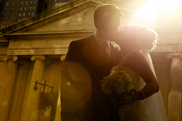 bride and groom kiss outside museum venue - wedding photo by top Philadelphia based wedding photographers Langdon Photography